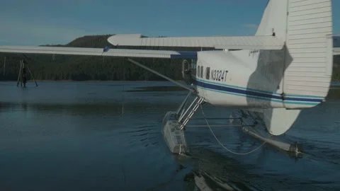 Float plane ready for take off in ocean bay in Alaska Stock Footage 195020656
