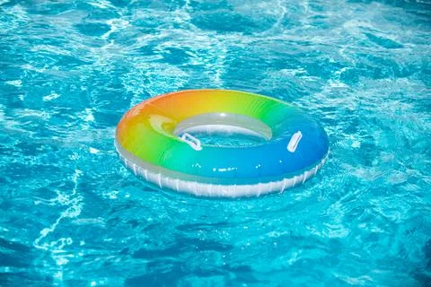 Float ring, floating in a swimming pool. Stock Photos