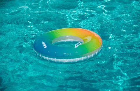Float ring, floating in a swimming pool. Stock Photos