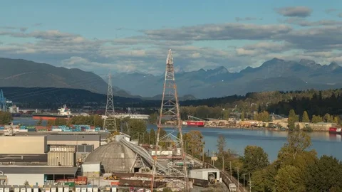 Floating 4K+ Hyperlapse / Timelapse over Delta, BC industrial Fraser River shore Stock Footage 76440051