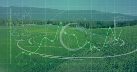 Floating analytics interface over rural farmland, showing line graph, HUD, cube Stock Photos
