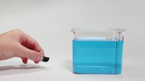 Floating and Sinking Experiment with Rubber Foam Block Video stock 308769283