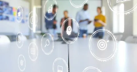 Floating AR icons hovering over conference table in office, with business-casual Stock Photos