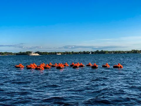 Floating artwork with dummies in the water Stock Photos