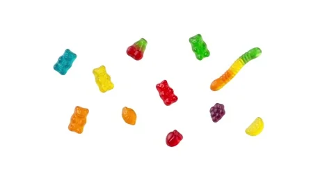 Floating assorted gummies isolated on white Stock Footage 339340659