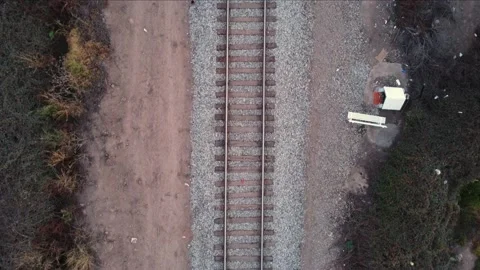 Floating backwards over a railway. Cenital aerial shot. Stock Footage 158778254