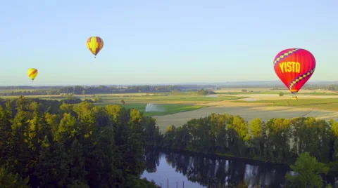Floating balloons over a river Stock Footage 56598453