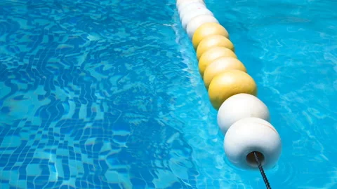 Floating balls on swimming pool Stock Footage 136078950