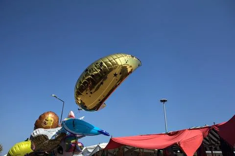 Floating baloons with a clear blue sky as background Stock Photos