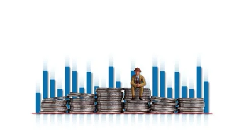 Floating bar graphs and a miniature man sitting on a pile of coins. Video stock 232642071