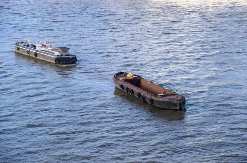 Floating Barges on the River Thames Stock Photos