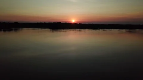 Floating below the sunset Video stock 94314952