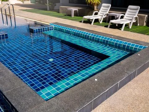 Floating bench seat, sitting zone in swimming pool with clean clear water, .. Stock Photos