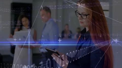 Floating binary code sparking woman interacting with tablet in office for Video stock 312481309