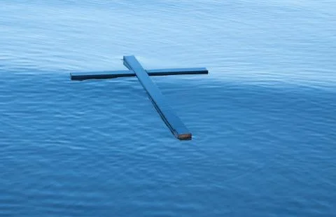 Floating black cross Stock Photos