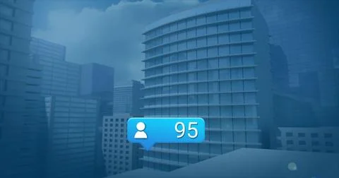 Floating blue bubble showing user icon with badge 95 drifting over urban skyl Stock Photos