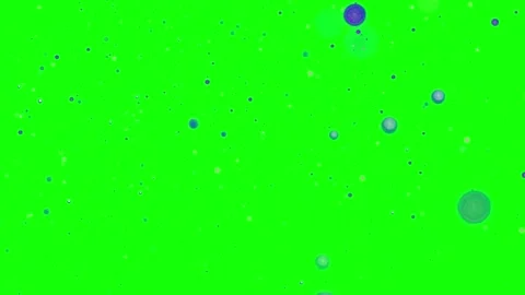 Floating blue bubbles on a bright green screen background for video compositing. Stock Footage 344927889