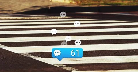 Floating blue chat bubble displaying 61 on zebra crosswalk, with white and gray Stock Photos