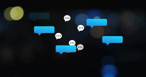 Floating blue-grey chat bubbles showing three-dot indicators over dark backdrop, Stock Photos
