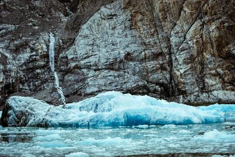 Floating blue ice in front of geologic structures at Endicott Arm near Dawe.. Stock Photos