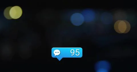 Floating blue message bubble showing speech icon and number 95 in dark blurre 库存照片