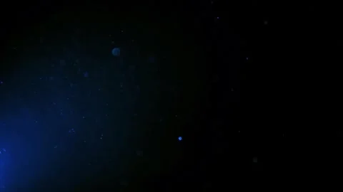 Floating blue particles in dark background. Video stock 335735307