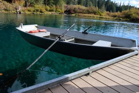 Floating boat at dock Stock Photos