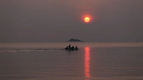 Floating boat at sunset Stock Footage 33871686