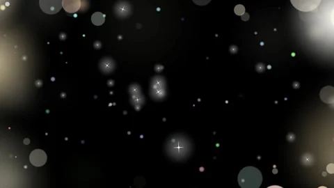 Floating bokeh lights drifting slowly across a dark background in a magical Stock Footage 340613110