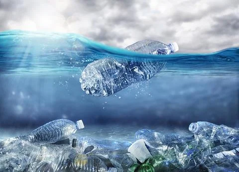 Floating bottle. Problem of plastic pollution under the sea concept Stock Photos