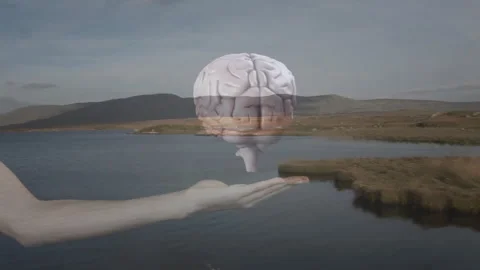 Floating brain animation over hand near serene lake with mountain background Stock Footage 305864413