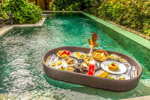 Floating breakfast in a swimming pool Foto stock