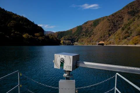 Floating bridge of drum containers on lake in Japan, sunny autumn day Stock Photos