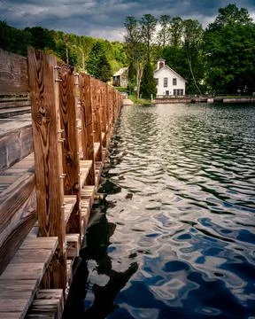 The floating bridge in the lake in the rural area Stock Photos