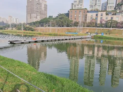 Floating bridge over the river, for cyclists and pedestrians. Stock Photos