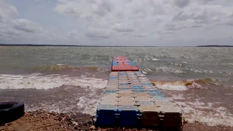 Floating bridge swaying with the ocean wave waters in  India. Stock Footage 247561522