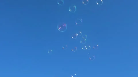 Floating Bubbles Against Blue Sky Stock Footage 279770354