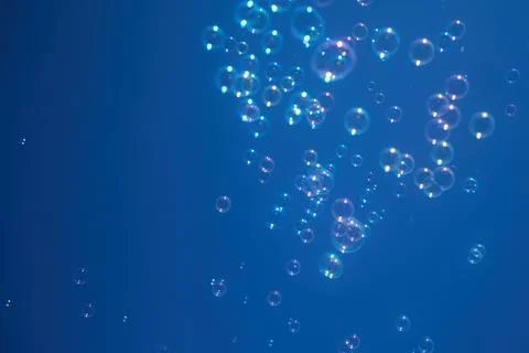 Floating Bubbles Against Blue Sky Stock Photos