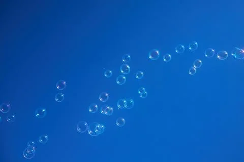 Floating Bubbles in Blue Sky Stock Photos