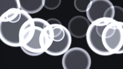 Floating bubbles in dark space with glowing edges creating Vídeo Stock 338003332