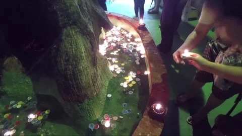 Floating Candles, Buddha Statues in Cave, Golden Mount Temple, Bangkok, Thailand Stock Footage 277456081