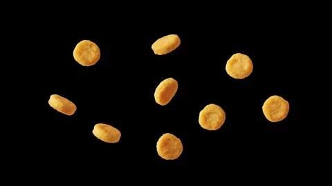 Floating chicken nuggets on a black background Stock Footage 339340507
