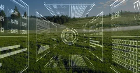 Floating circular digital interface hovering over rural hillside meadow, with Foto stock
