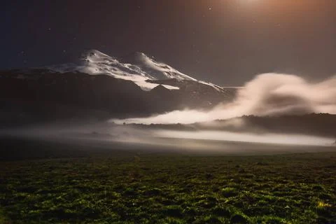 A floating cloud in the vicinity of the sleeping Elbrus volcano in the Cau... Fotos Stock