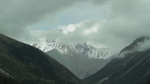 Floating clouds in the mountains-1 Stock Footage 76006480