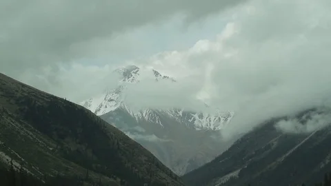 Floating clouds in the mountains-2 Stock Footage 76005588