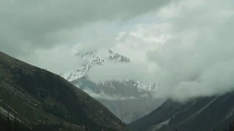 Floating clouds in the mountains-4 Stock Footage 76005589