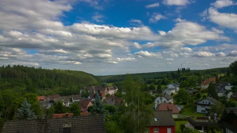 Floating clouds over the German village of Friedenweiler. Timelaps. Stock Footage 90295288