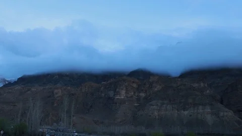 Floating clouds over mountains 스톡 동영상 121965246