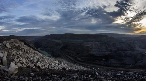 Floating clouds over open pit at dawn. Timelapse Stock Footage 47355785